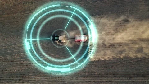 5G autonomous tractor without a driver working the soil before sowing. Future Video stock 194952749