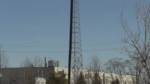 5G Cell phone and communications tower with radio antennas on it 스톡 동영상 150745322