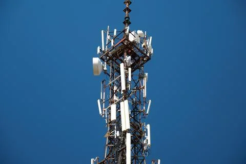 5G Cell tower on blue background Stock Photos