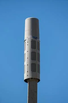 5g communication cell phone service tower on blue sky Stock Photos