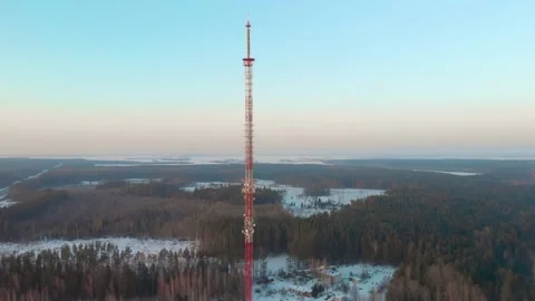 5G mobile tower in a remote rural area on a winter evening Stock Footage 150136988