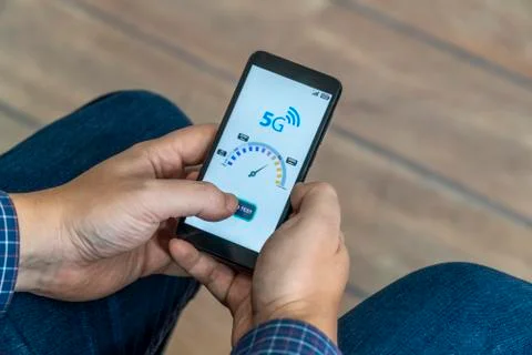 5g network speedtest performed on a mobile phone Stock Photos