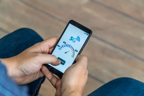 5g network speedtest performed on a mobile phone Stock Photos