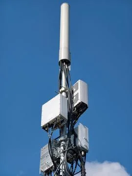 A 5G network tower transmitting data signals under the open sky Stock Photos