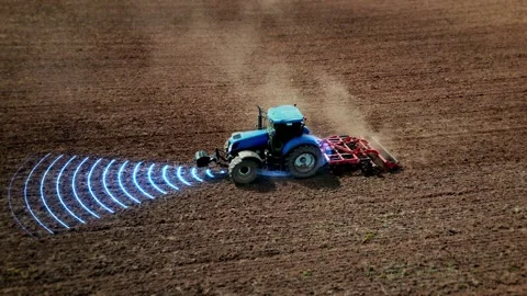 5G self-driving autonomous tractor without driver working the soil. Smart Video stock 246621468