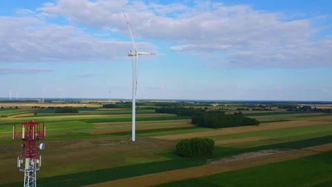 5G Tower and Wind Turbines Operating in Rural Agricultural Landscape Stock-Footage 342592175