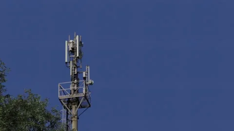 5G tower on background a clear blue sky. Cell tower with monitoring and control  스톡 동영상 133138168