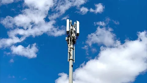 5G tower with blue sky and clouds background Stock Footage 340534098