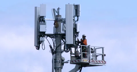 5G Tower Close Up - Workmen Tinkering In The Shadows Vídeo Stock 272694790
