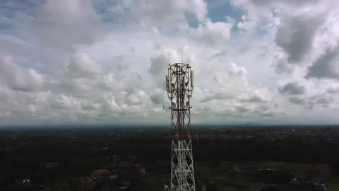 5g tower drone rotate around rural village Stock Footage 144036676