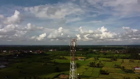 5g tower drone rotate around rural village agricultural land Stock Footage 144036741