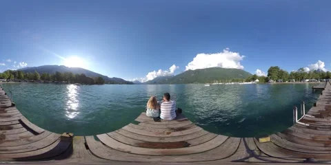 5K 360VR Couple sitting in a dock admiring the Annecy lake in the French Alps Stock Footage 152566729
