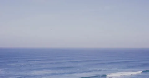 5K Calm ocean moving around with people on cliff viewpoint in day time Video stock 156279936