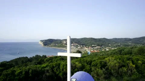 5k HDR Aerial Corfu rising slowly up from white Chapel revealing City 10Bit Stock Footage 198769853