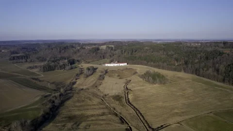 5k HDR Aerial View of Fields and Pine Forest with Building in Bavaria 10Bit Stock Footage 179422187