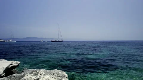 5k HDR Corfu Greece viewing Sailboats from rocky Coast 10Bit 스톡 동영상 198952928