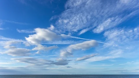 5k time lapse of dramatic clouds over the Colwyn Bay wind farm, North Wales Stock Footage 105478776