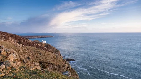 5k time lapse of evening clouds over Elin's tower at South Stack, Anglesey Video stock 110351861
