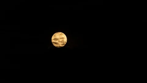 5k time lapse of the full moon passing behind clouds at night Stock Footage 108778585
