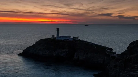 5k time lapse ship and lighthouse, South Stack, Anglesey, North Wales Stock Footage 110328523