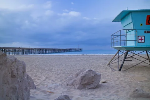 5k Time lapse, Sunrise on beach with pier and lifeguard tower Stock Footage 42689078