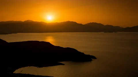 5k time lapse of sunset and dusk over the coast of Crete Stock Footage 105851123