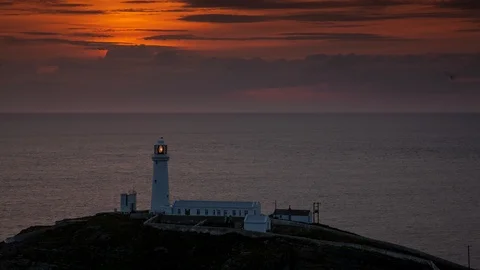 5k time lapse sunset over South Stack lighthouse, Anglesey, Wales Stock Footage 109802676