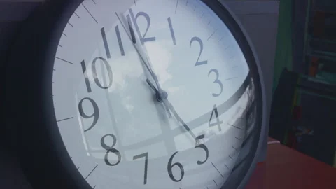 5pm 1.5 hour time lapse of wall clock reflecting clouds moving Stock Footage 273120738