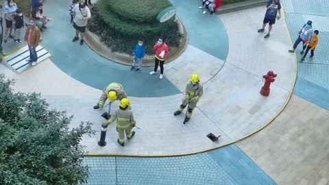 6 2 2021 Fire men checking water from fire hydrant in a residential building  Stock Footage 149359147