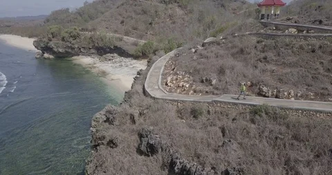 6. aerial view, bird view from a man in a green jacket running on the edge of Stock Footage 121700445