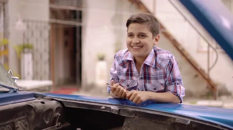 6-Boy Fixing Car Engine Gives Five To Grandpa Stock Footage