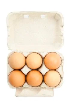 6 eggs in a box isolated on a white background Stock Photos
