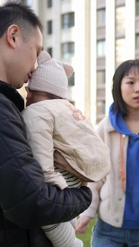 A 6 -month -old baby, Shanghai, China, and grandmother live. They stand in a 動画素材 300822853