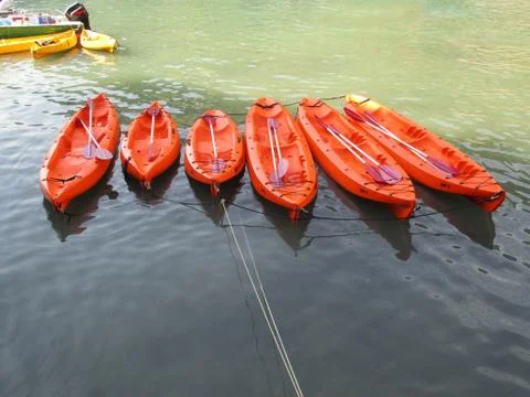 6 orange canoe with oars b Stock Photos
