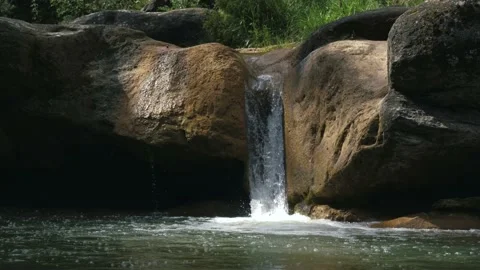 6 shots of an idyllic stream and its small waterfall surrounded by green veg 動画素材 134642186