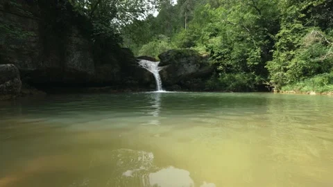 6 shots made with stabilizer and tripod of a beautiful waterfall and its str Stock Footage 134642231