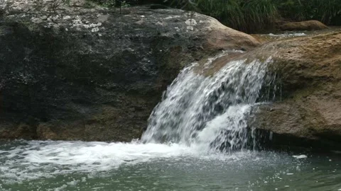 6 shots made with a tripod of a small waterfall and its wonderful stream wit 動画素材 134642187