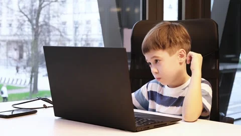 6 year boy using laptop in office. Distance self education. Programming lesson Stock Footage 265059822