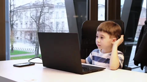 6 year boy using laptop in office. Distance self education. Programming lesson Stock Footage 279425401