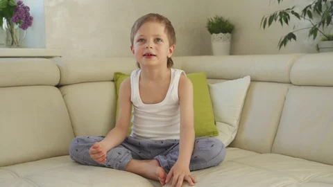 6 year old boy catching green apple and eat Stock Footage 107912383