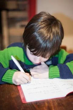 6-year-old child performs homework Stock Photos