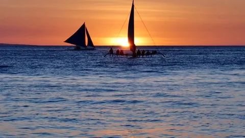 60 fps shot of some undefined tourists enjoying sunset sailing Stock-Footage 70041325