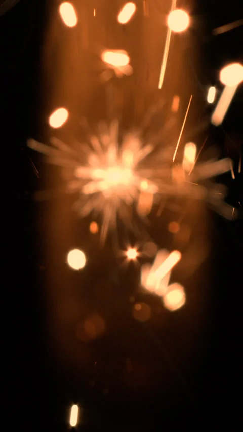 600 fps super slowmotion fireworks: Close up sparkler, red, vertical format HD Video stock 254491729