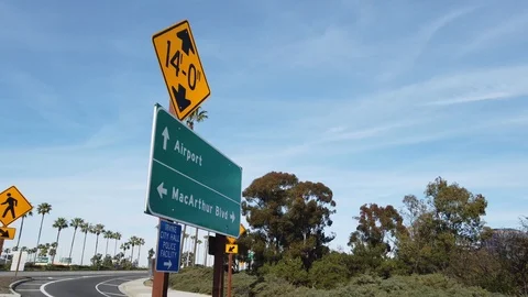 60fps driving shot entering John Wayne Airport in Santa Ana, California Stock Footage 107940593
