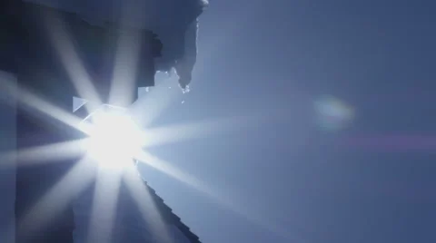 60fps  Slow Motion Sun melting rooftop ice shot on Red Scarlet Dragon Camera Video stock 60056562