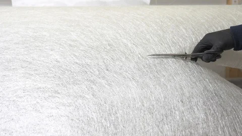 62 year old man cutting fiber with scissors in the workshop. 스톡 동영상 122253836