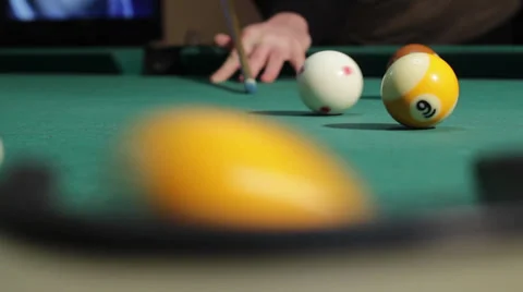 6/35 Man playing billiard. Player is taking a shot and put ball in the hole. Stock Footage 36431472