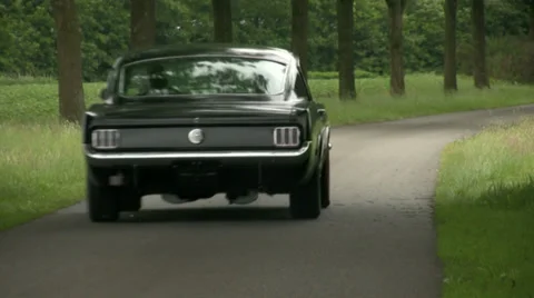 65 Fastback Mustang drive by Stock Footage 33327740
