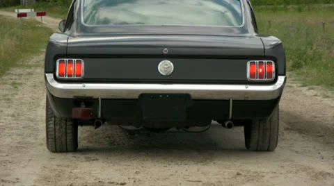 65 Fastback Mustang pulling up Stock Footage 33327800