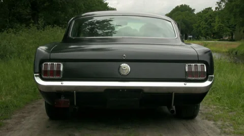 65 Fastback Mustang pulling up Stock Footage 33327848